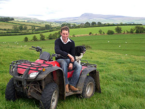 Ian sitting on quad-bike